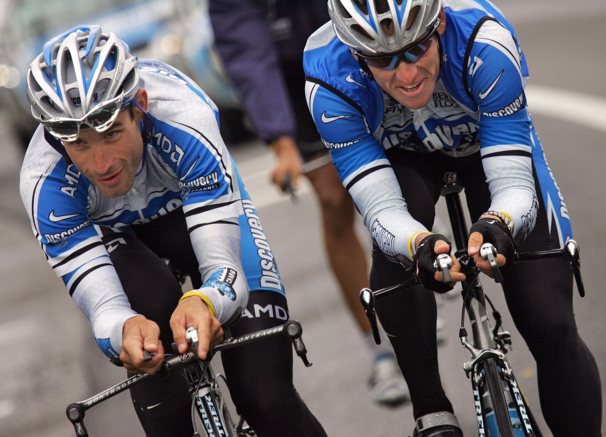 Lance Armstrong and George Hincapie ride together during a stage of the 2005 Tour de France