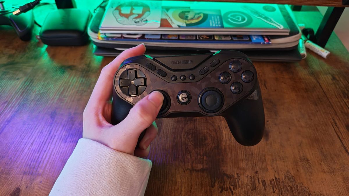 The GameSir Tarantula Pro being held by a reviewer