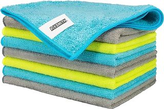 A stack of blue, gray and lime green Fixsmith microfiber cloths