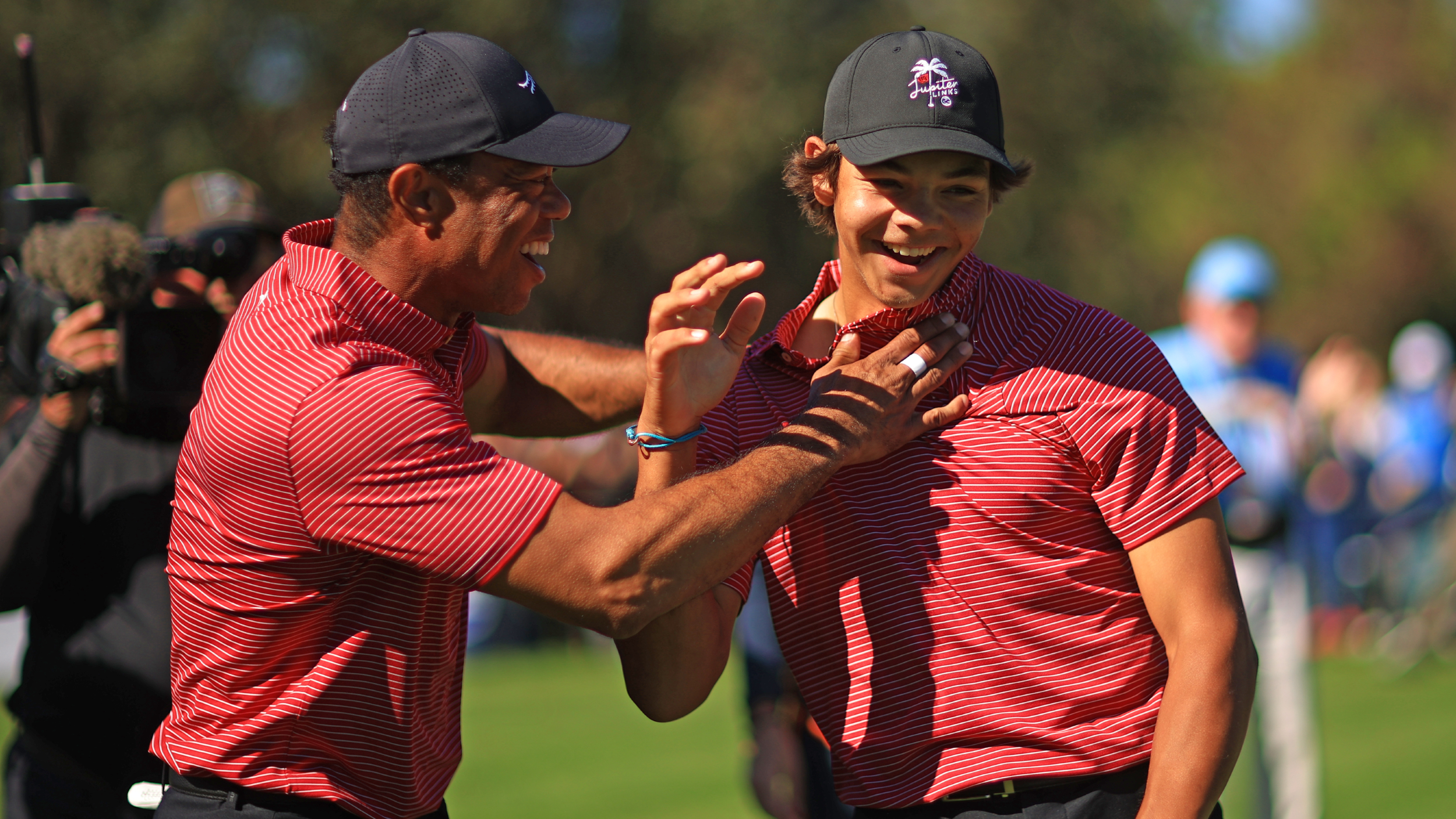 Tiger Woods celebrates Charlie's hole in one at the PNC Championship