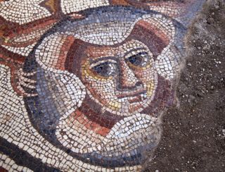 A section of the mosaic showing a theater mask uncovered in summer 2015 at an archeological dig in the town of Huqoq in northern Israel