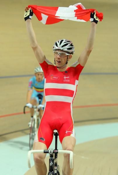 Men's Madison - Michael Morkov flies the Danish flag after he wins the championship
