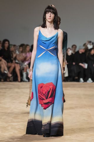 Woman on runway in Paco Rabanne dress with flower motif