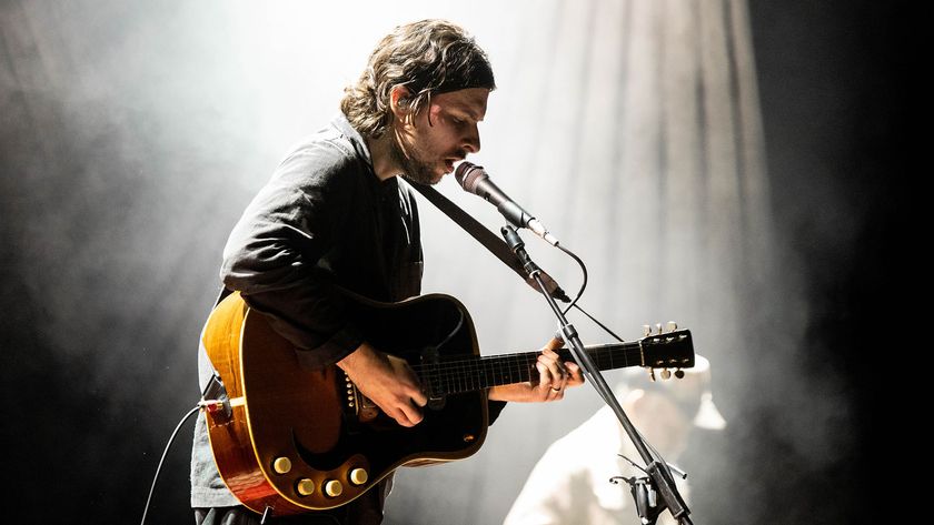 Mitch Rowland playing an acoustic guitar onstage at The Fillmore on February 25, 2024 in San Francisco, California
