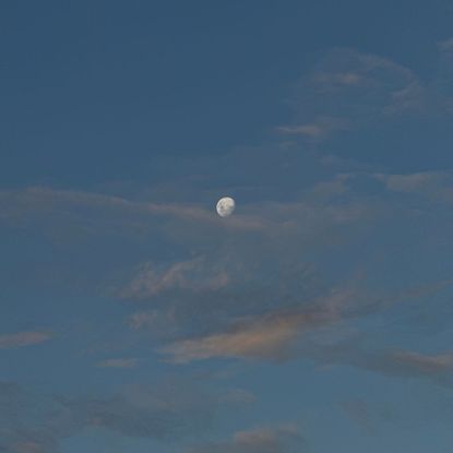 The moon in the sky, a sound bath, and a woman stretching