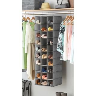 Gray fabric hanging shoe organizer in closet