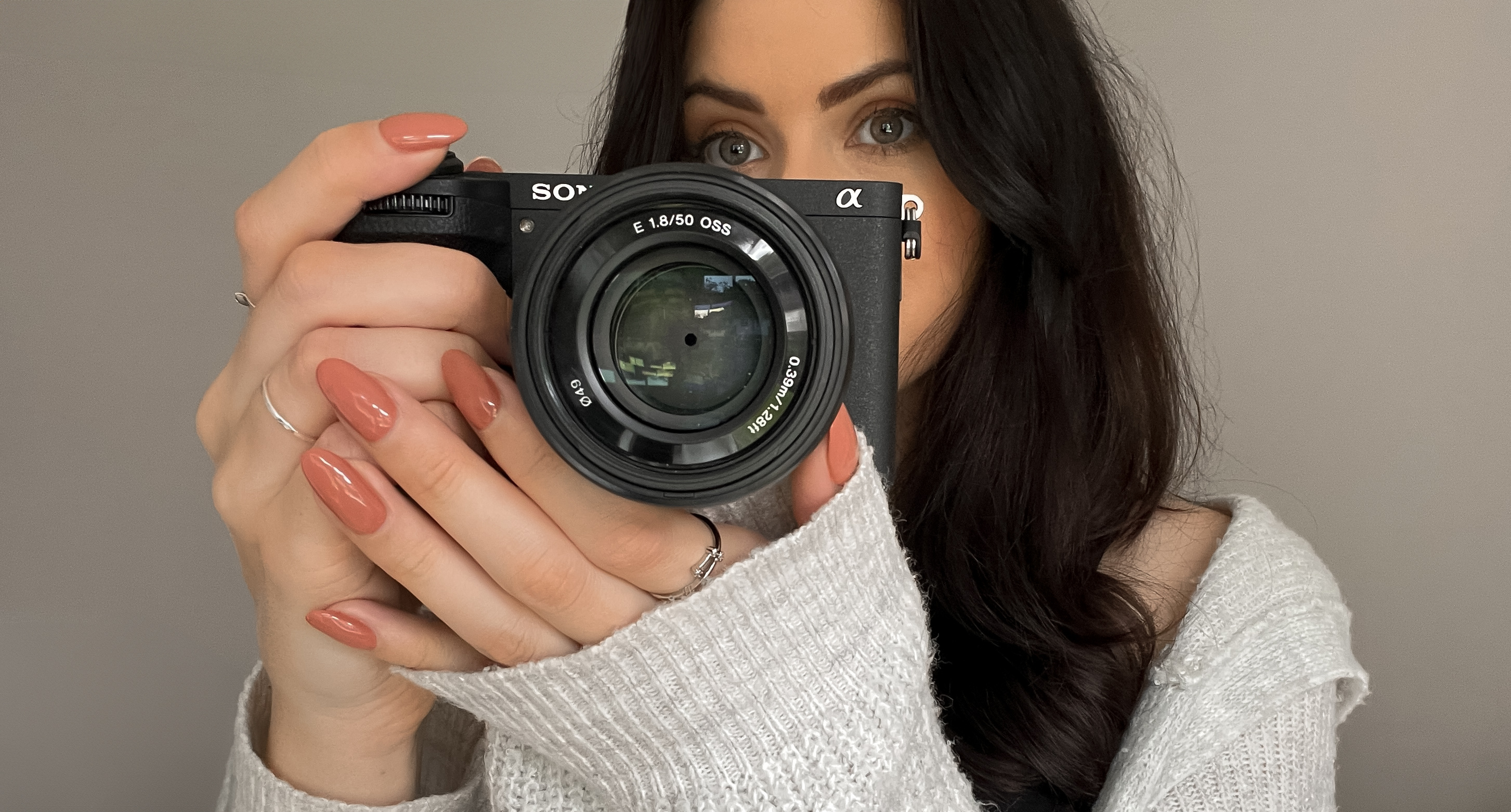 Sony A6700 being held by the reviewer