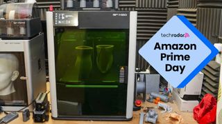 The Bambu Lab H2D in our workshop under review, next to a TechRadar badge that reads 'Amazon Prime Day'