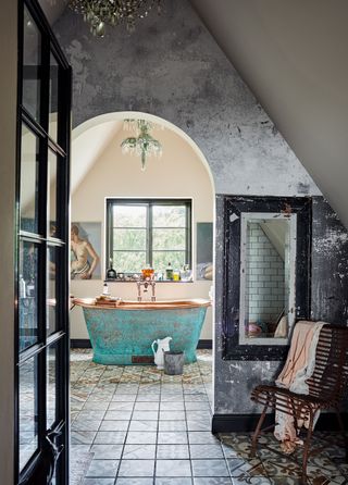 copper colored freestanding bath viewed from doorway