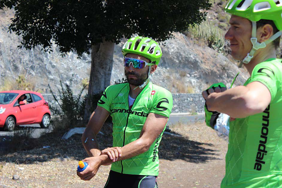 The riders stop to talk off some layers for the remainder of the ride
