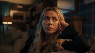 Rebecca (Eve Myles) sits on the sofa in Coldwater episode 4 recap