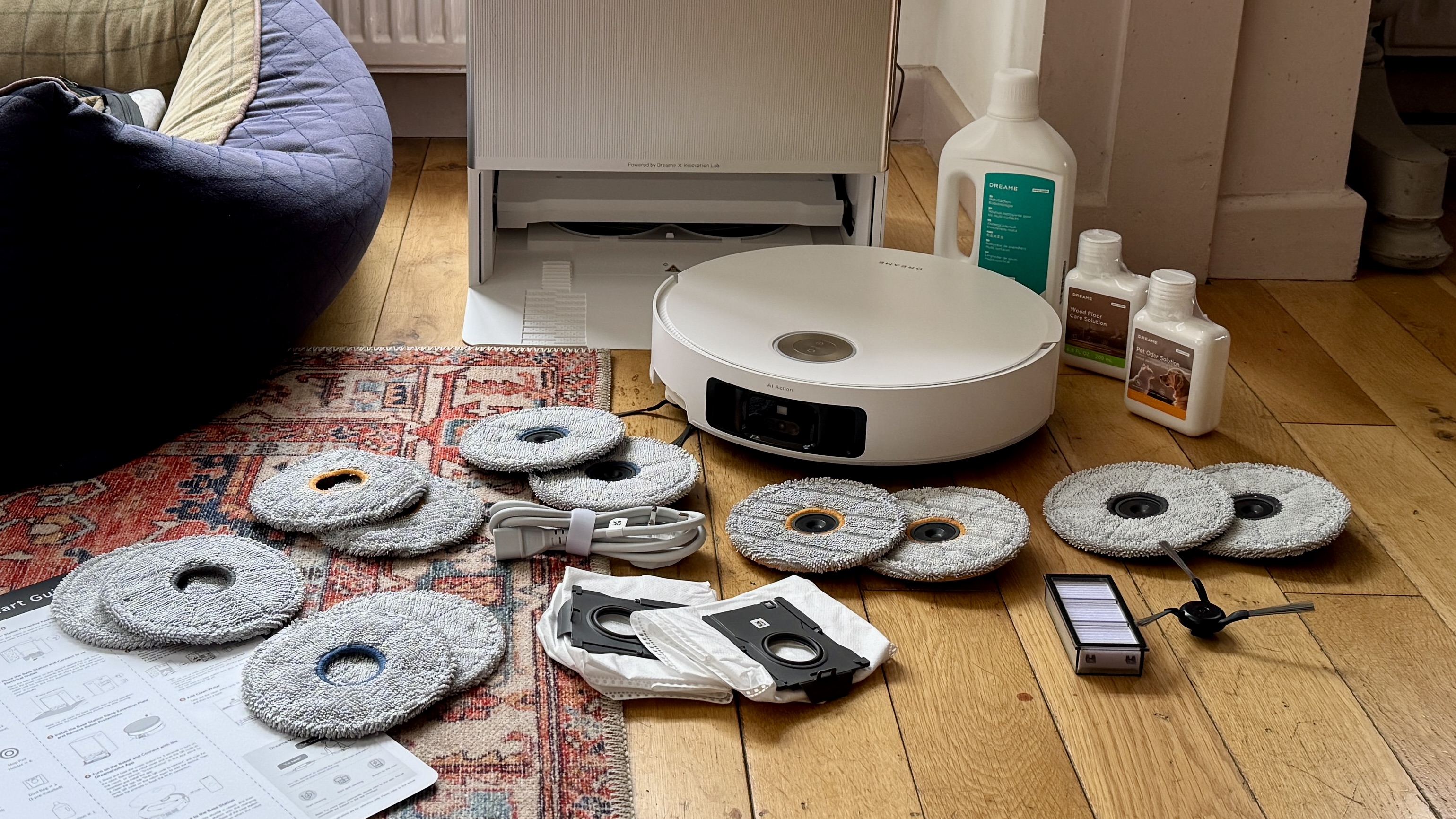Dreame Matrix10 Ultra robot vacuum surrounded by all the accessories supplied in the box