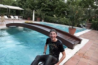 Frank Schleck climbs out of swimming pool