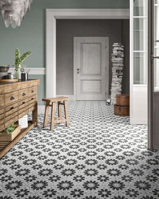 Patterned monochrome floor with wood kitchen