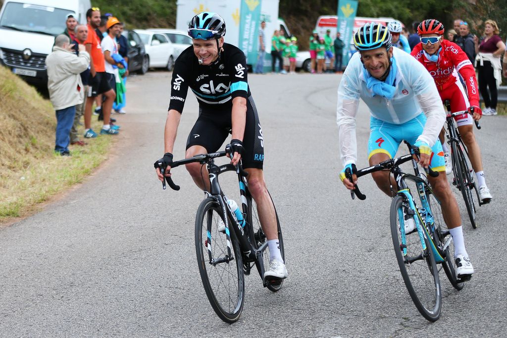 Chris Froome descends to the team bus with a whistle to let the fans know