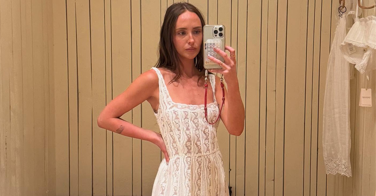 Makenna wears a white lace maxi dress.