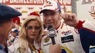 Leslie Bibb and Will Ferrell being interviewed after a race in