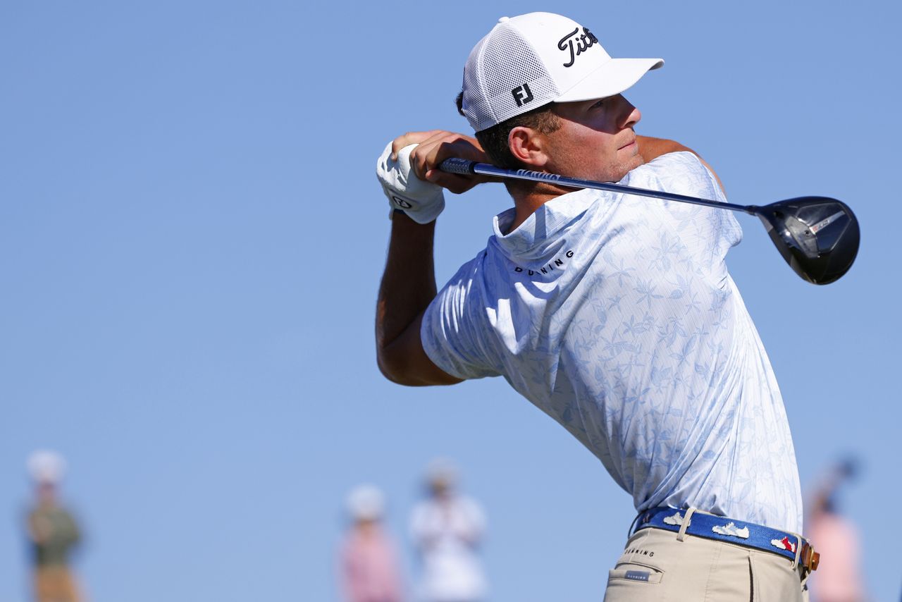 Michael Brennan hits a tee shot with a driver