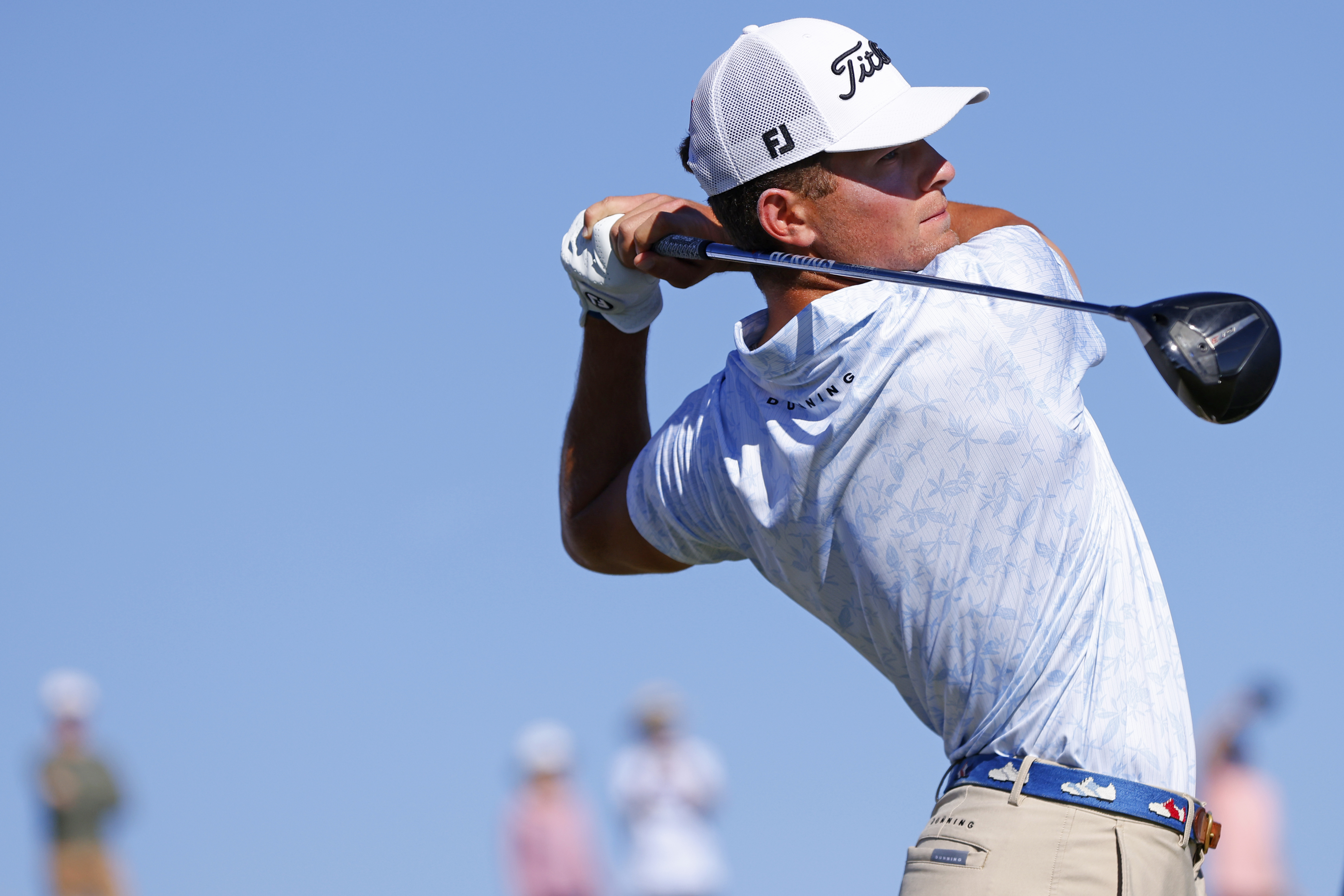 Michael Brennan hits a tee shot with a driver