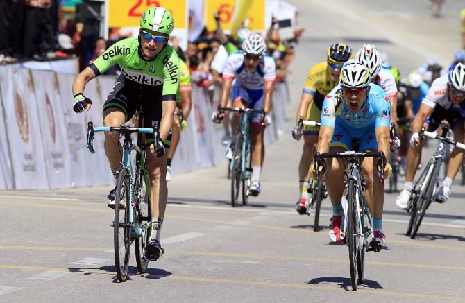 Theo Bos celebrates victory ahead of Andrea Guardini.