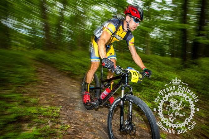 Brian Matter riding a wooded section of stage 7.