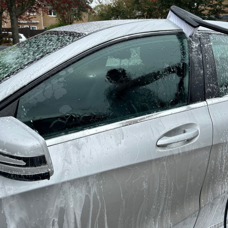 Webb pressure washer with brush cleaning silver car