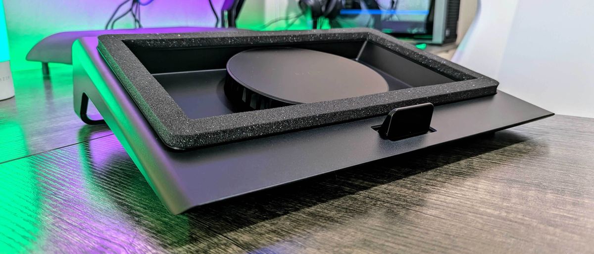 The Razer Laptop Cooling Pad on a desk, showing the fan and magnetic frame.