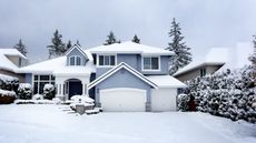 snow storm in Northwest United States with residential home in background