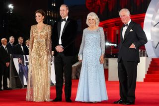 Catherine, Duchess of Cambridge, Prince William, Duke of Cambridge, Camilla, Duchess of Cornwall, and Prince Charles, Prince of Wales, attend the "No Time To Die" World Premiere at Royal Albert Hall on September 28, 2021 in London, England.