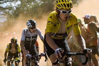Great Britains Geraint Thomas R wearing the overall leaders yellow jersey and Great Britains Christopher Froome C rides through the socalled Dutch Corner in the ascent to lAlpe dHuez during the twelfth stage of the 105th edition of the Tour de France cycling race between BourgSaintMaurice Les Arcs and lAlpe dHuez on July 19 2018 AFP PHOTO Jeff PACHOUD Photo by Jeff PACHOUD POOL AFP Photo credit should read JEFF PACHOUDAFP via Getty Images