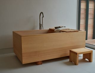 Wooden bathtub at Shou Sugi Ban House in the Hamptons New York