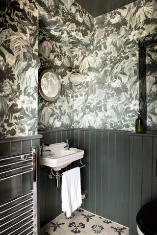 powder room with monochrome black and white scheme and patterned wallpaper