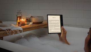Amazon Kindle Oasis being used by a woman in the bath