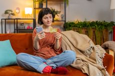 Best easy-access savings concept woman looking at credit card