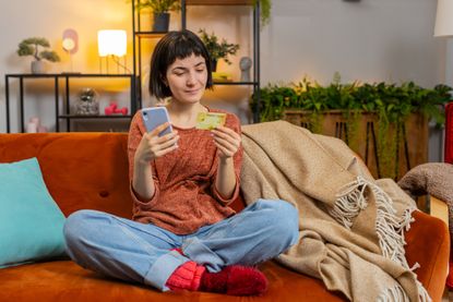Best easy-access savings concept woman looking at credit card