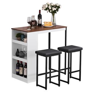 A bar-style dining set with a table with storage and two stools