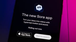 The Sora App home page displays on a smartphone screen placed on a computer keyboard illuminated by blue and purple light.