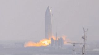 SpaceX's SN9 Starship prototype conducts its first static-fire test, on Jan. 6, 2021, in this screenshot from a video captured by SPadre.com