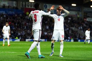 Folarin Balogun (left) celebrates