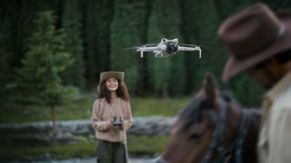 The DJI Mini 4 Pro in use in a forest, with a cowboy on a horse in the foreground