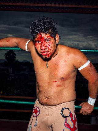 Mexican wrestler with bloody face