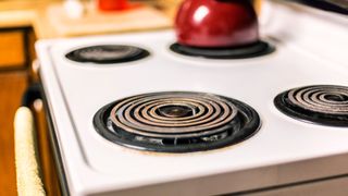 An electric stove top with corroded burners