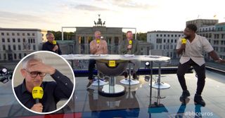 Gary Lineker, Alan Shearer and Wayne Rooney laugh at Micah Richards on the BBC's rooftop studio in Berlin overlooking the Brandenburg Gate