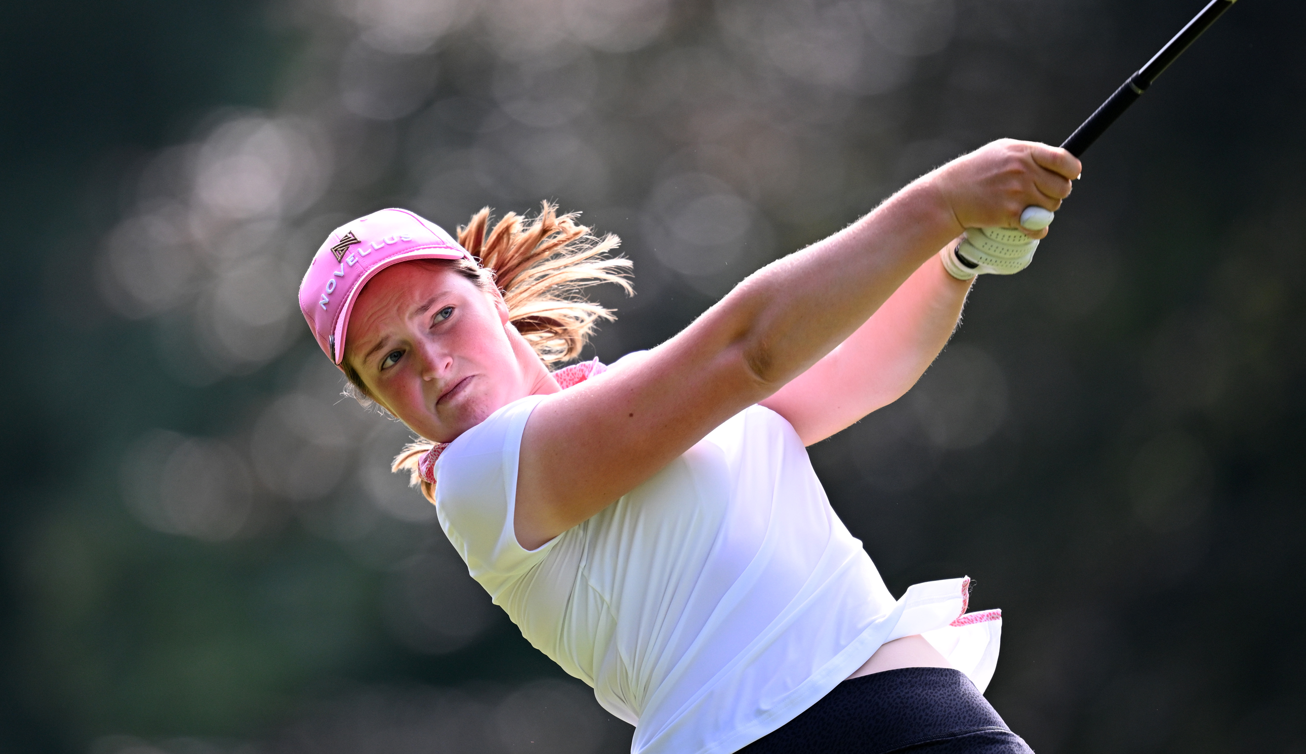 Lottie Woad hits a tee shot with her driver