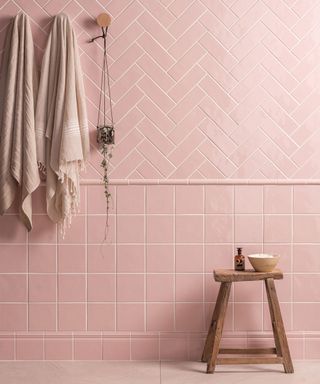 Pink painted bathroom tiles in bathroom