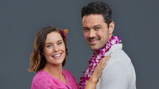 Ashley Williams and Ryan Paevey in a promotional photo for Hallmark's Two Tickets to Paradise