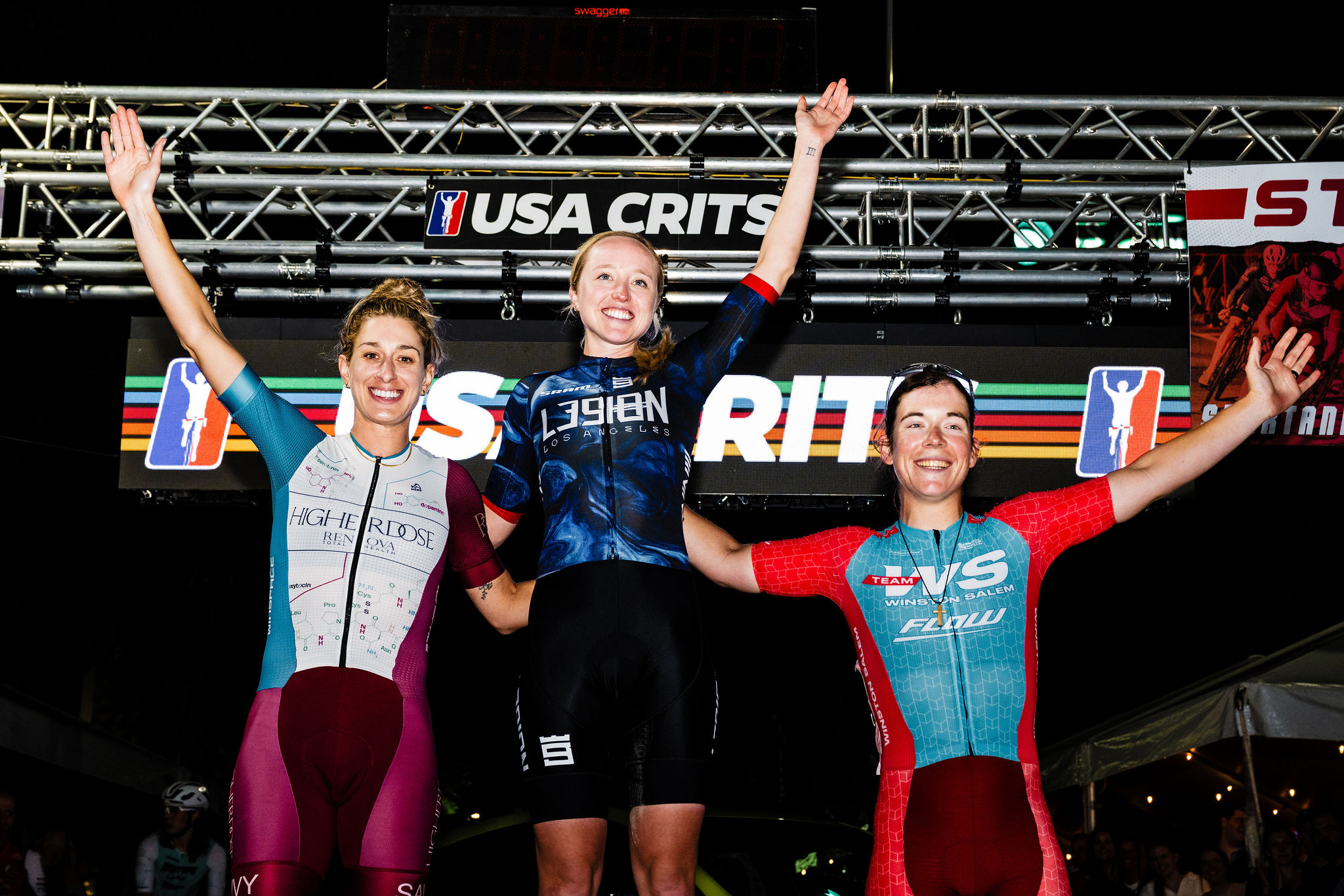 Skylar Schneider celebrates on the top step (centre) of the podium as winner of Spartanburg Criterium
