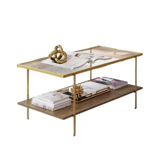 A gold coffee table with decorations