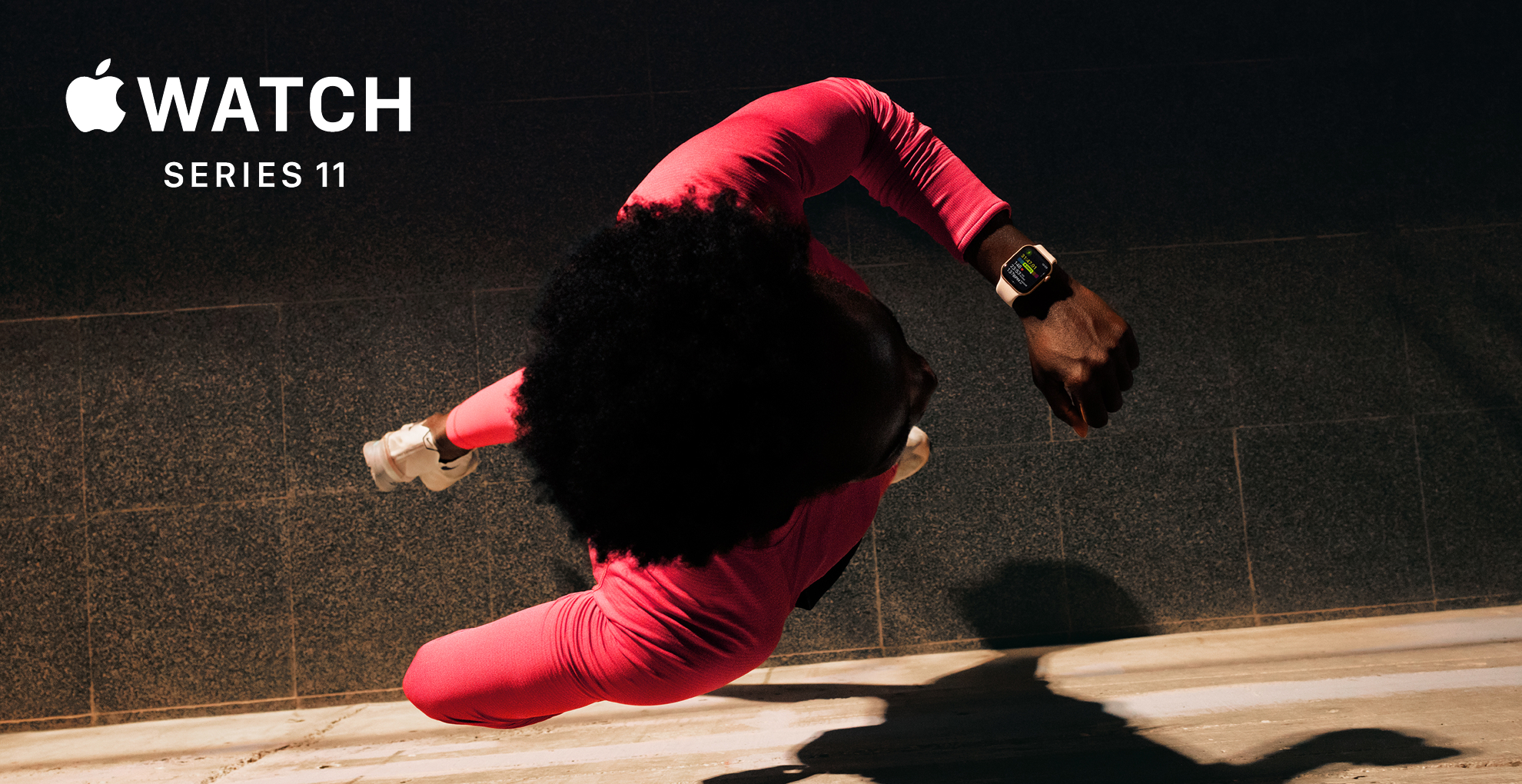 Marketing image for the Apple Watch Series 11 - an overhead image of a runner in red