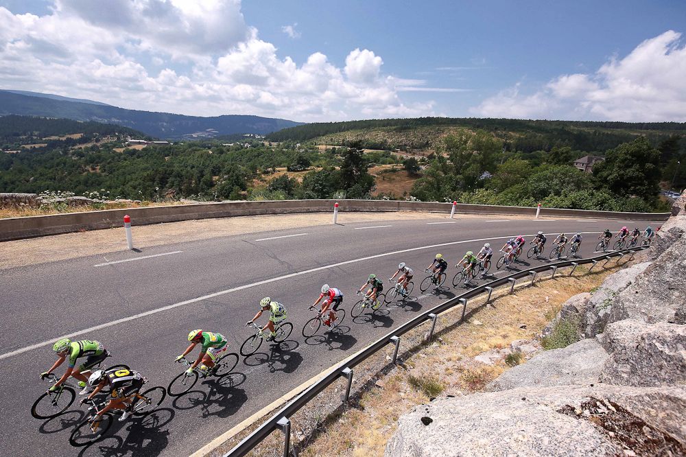 The peloton rolls through the French countryside during stage 15.